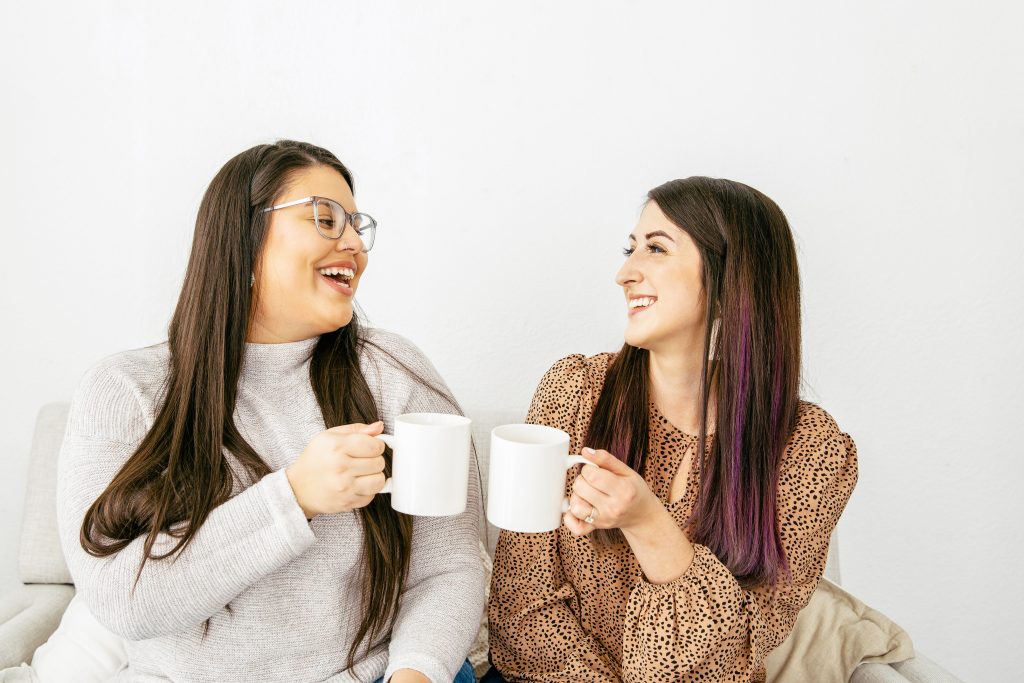 Two ladies with coffee mugs