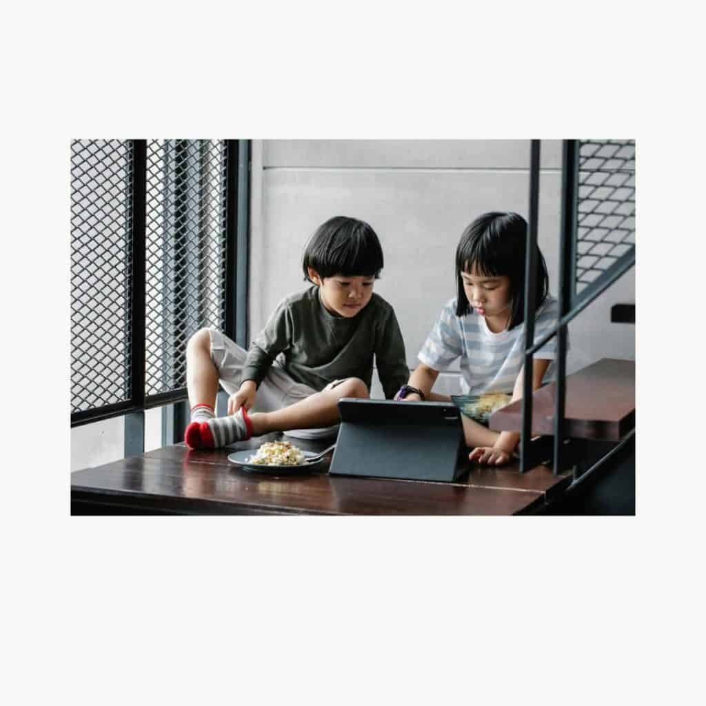 Kids playing on devices instead of eating